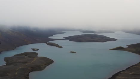 aerial view of langisjor lake in highlands of iceland during mystic foggy day