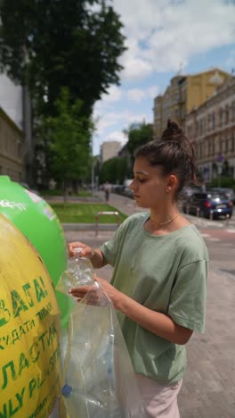 teenager recycling plastic bottle in public space