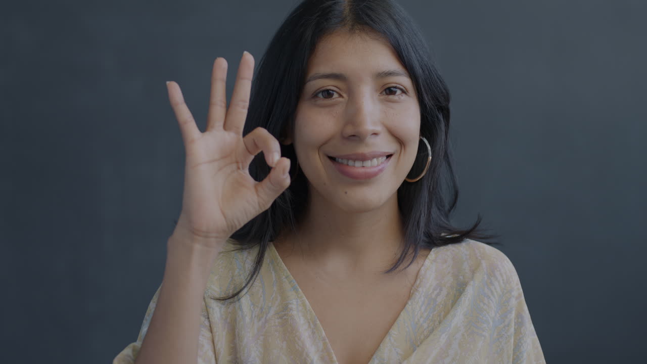 Woman making an ok sign