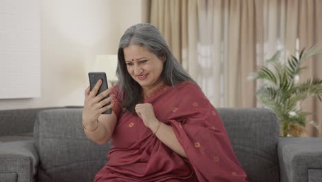 Happy-Indian-old-woman-talking-on-video-call