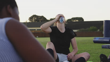 young adult female rugby team training