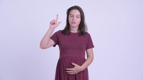 happy young beautiful pregnant woman