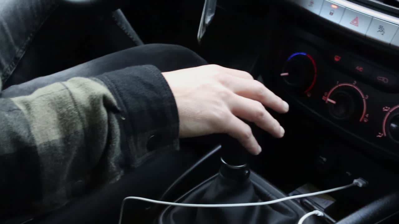 Close Up of Hand Shifting Car to Fourth Gear While Driving