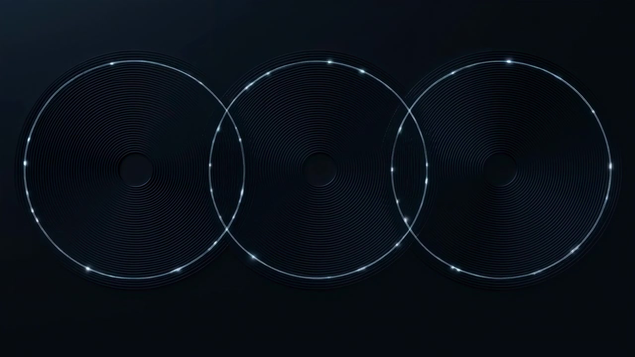 Three aligned ring patterns grow larger over time across dark field as small luminous points shift around outer circles and neighboring forms gradually begin to intersect.
