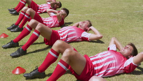 soccer players working out on field