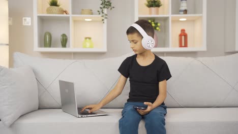 Thoughtful-boy-focused-on-tech-stuff.