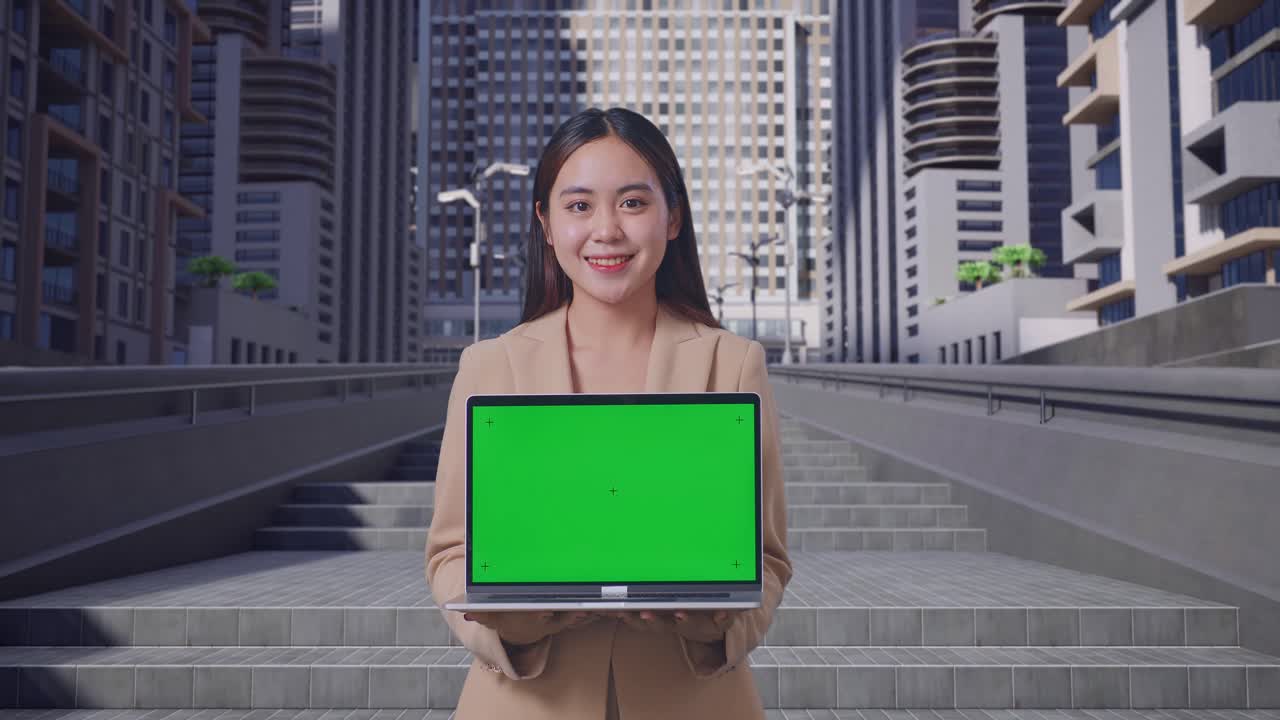 도시 에서 녹색 스크린 디스플레이 를 가진 노트북 을 들고 있는 사업가