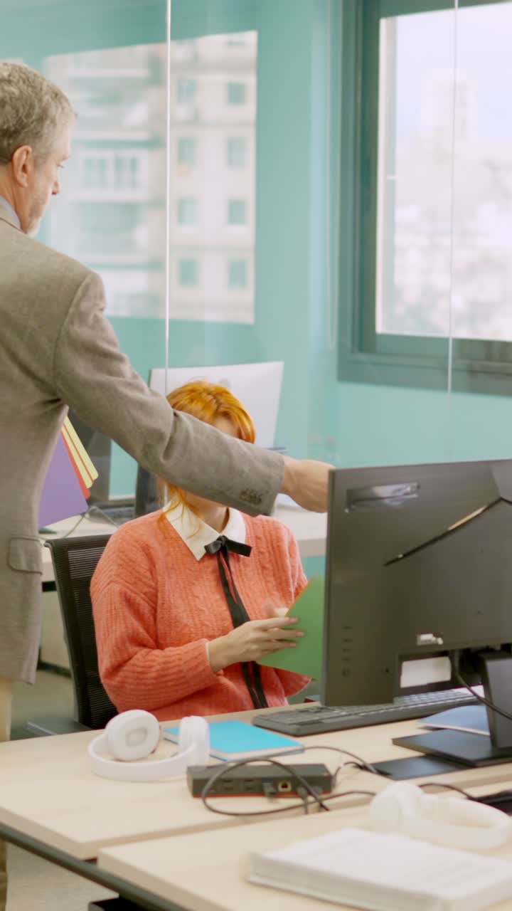 Manager distributes files to a team in coworking space