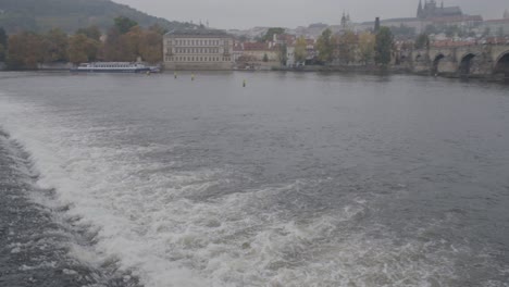 panoramic panning view of prague with charles bridge and prague castle