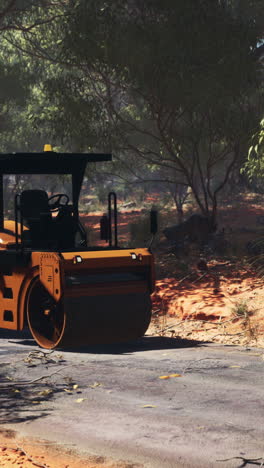 road roller compacting asphalt on a remote road