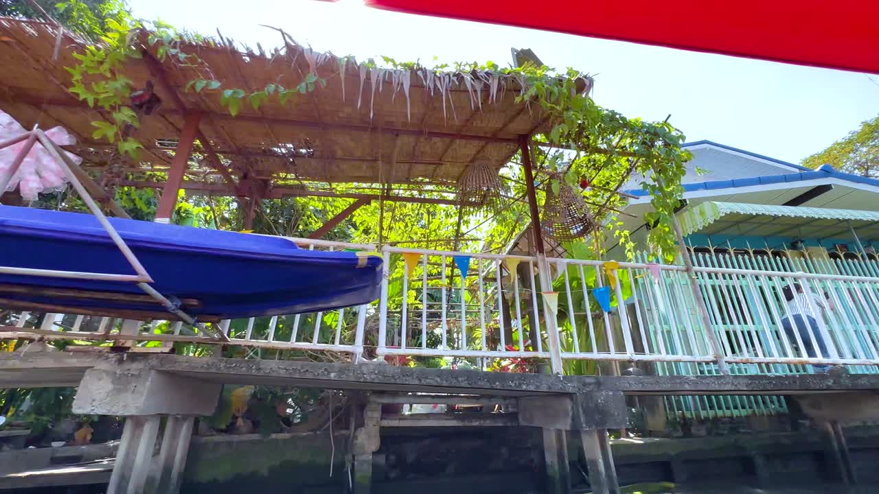 Scenic canal view with vibrant market stalls