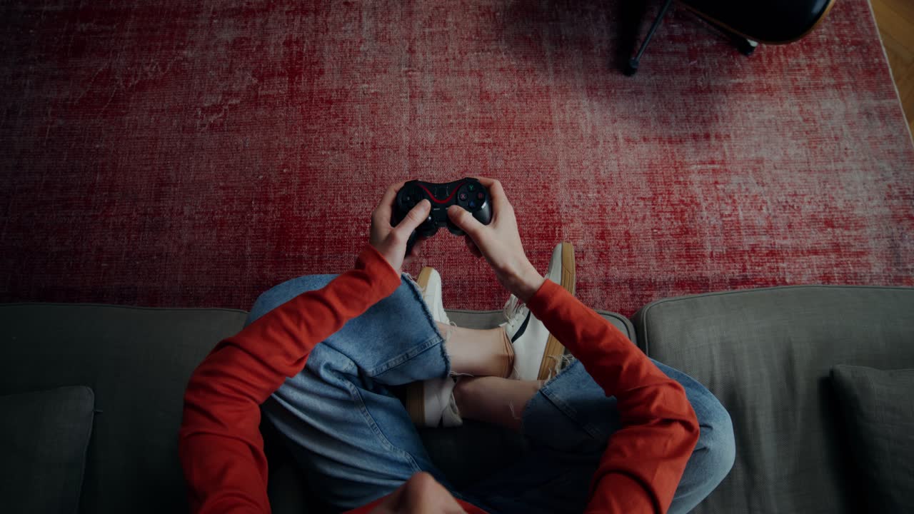 Person Playing Video Games on Couch