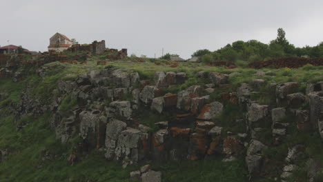 ruins covered with yellow lichen with the small