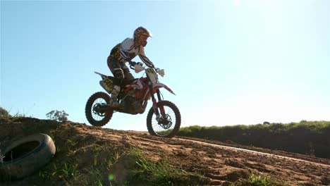 man riding a motor cross bike