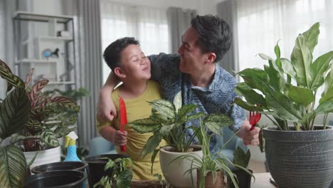 Father and Son Gardening Together at Home