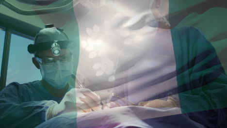 animation of flag of nigeria waving over surgeons in operating theatre
