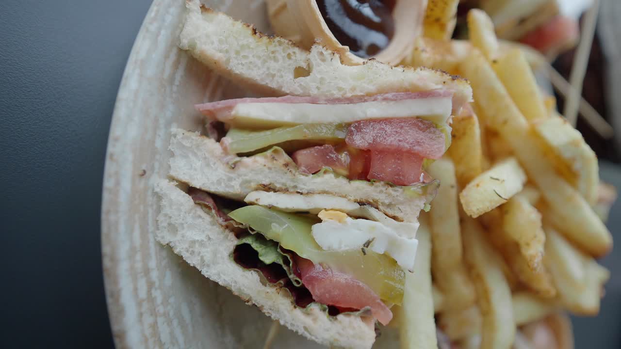 Club sandwich with fries