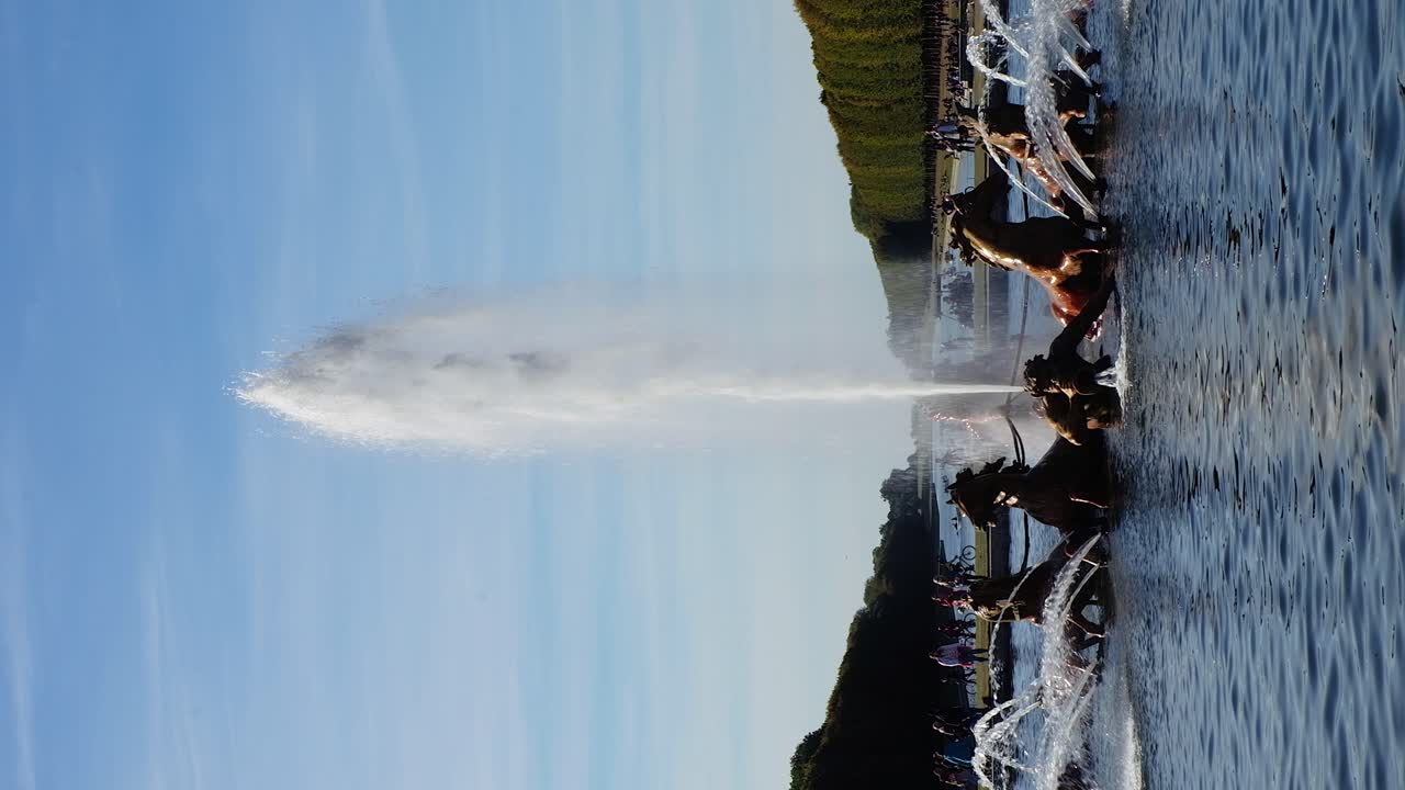 Versailles, France - April 21, 2021: View of the Apollo Fountain in the Gardens of the Palace of Versailles. Vertical