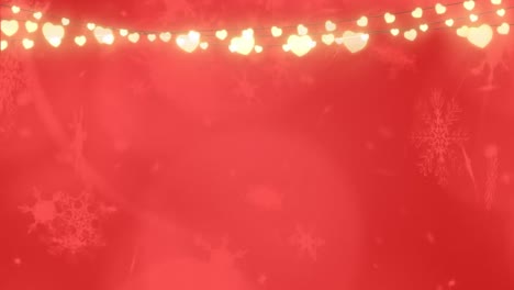 snowflakes falling over glowing fairy lights red background