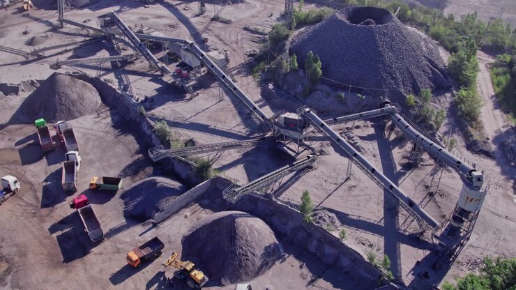 Quarry site with equipment and trucks in operation