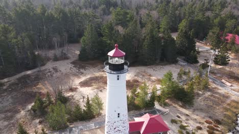 4k drone video of crisp point lighthouse in michigan during the fall