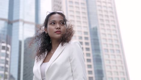 smiling business woman in a city