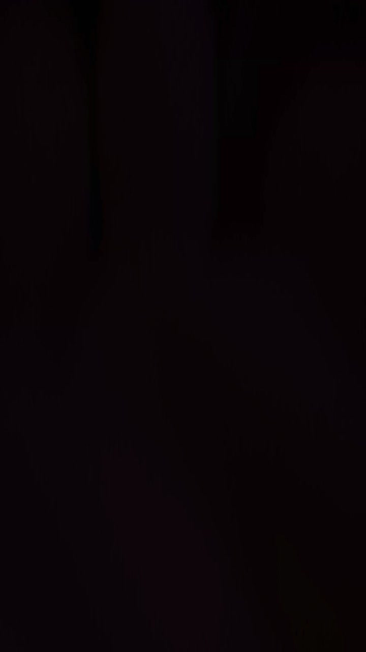 Abstract Motion Background with Shifting Orange and Black Light Patterns