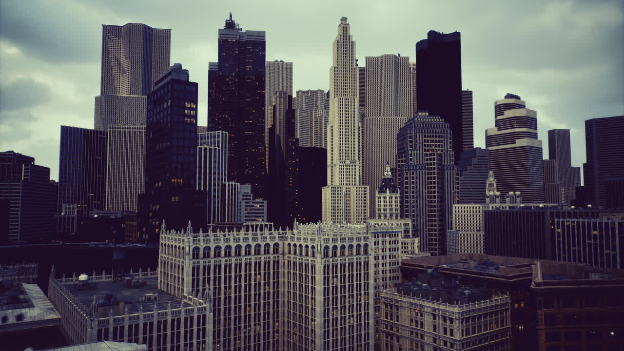 Skyscrapers rise majestically over a bustling urban landscape during twilight