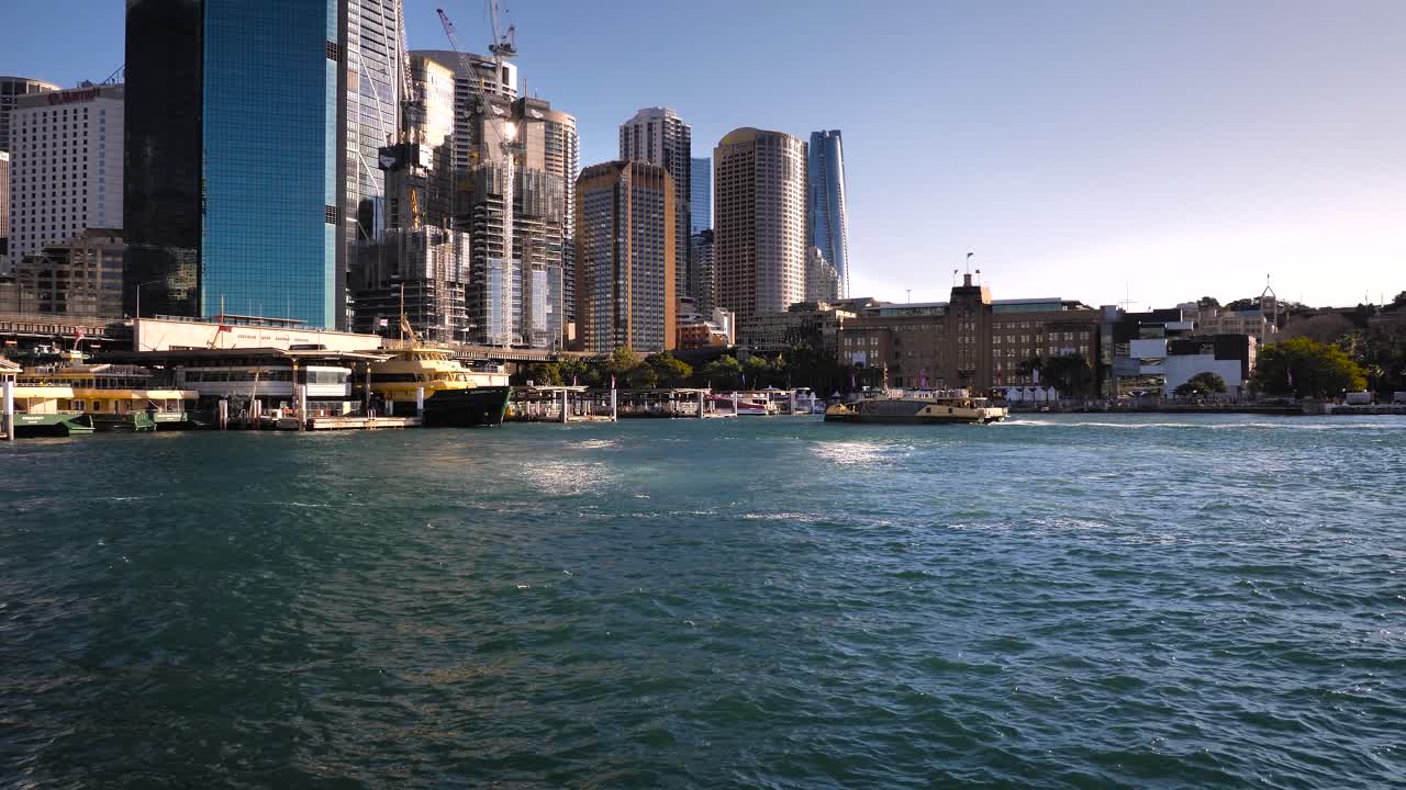 Sydney Harbor Cityscape with Ferries and Modern Buildings
