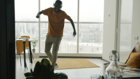 man dancing to music at home
