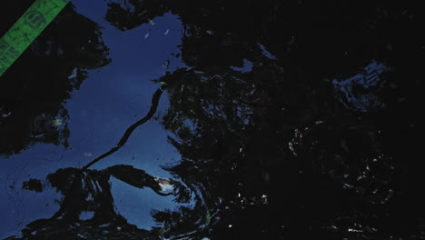 aerial shot bird's eye view of a pond and blue sky reflection and reveal a green slack line