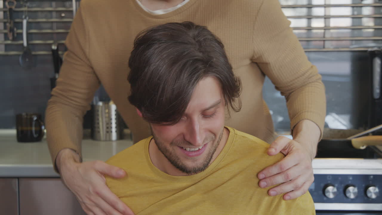 Happy Man Surprising Boyfriend with Breakfast