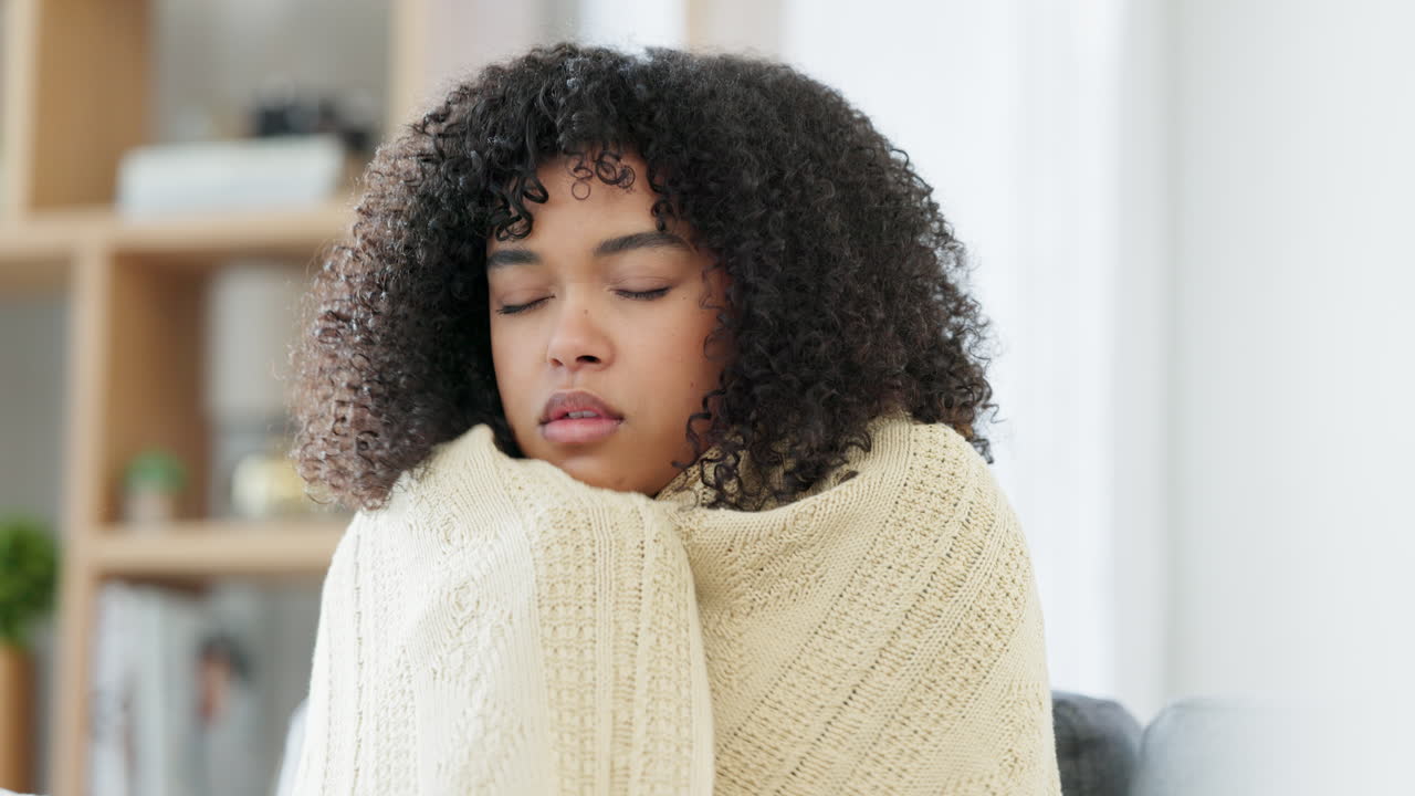 Sick woman with covid blowing her nose