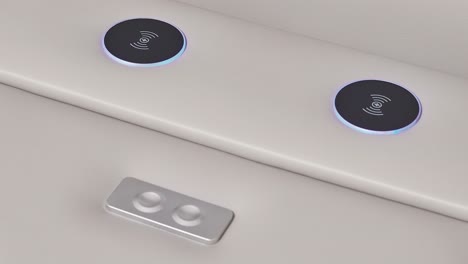 camera pushes into arm-panel ports and buttons on modern white leather couch
