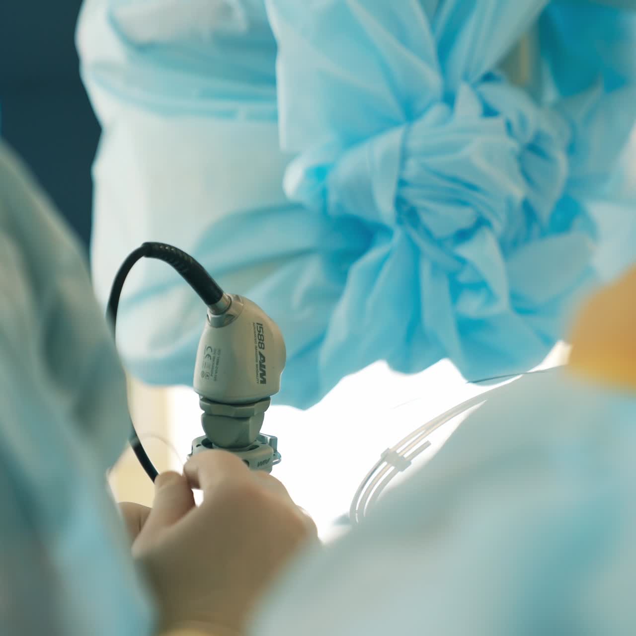 A couple of doctors using tools at operation. Professional medics performing surgery in modern clinics close up