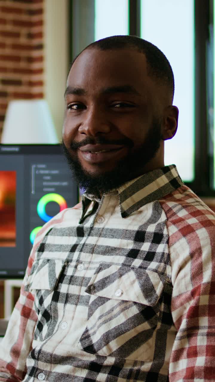 Vertical Video African american male filmmaker works with creative editing software