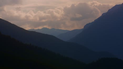 mountains with smoke and clouds in the dawn