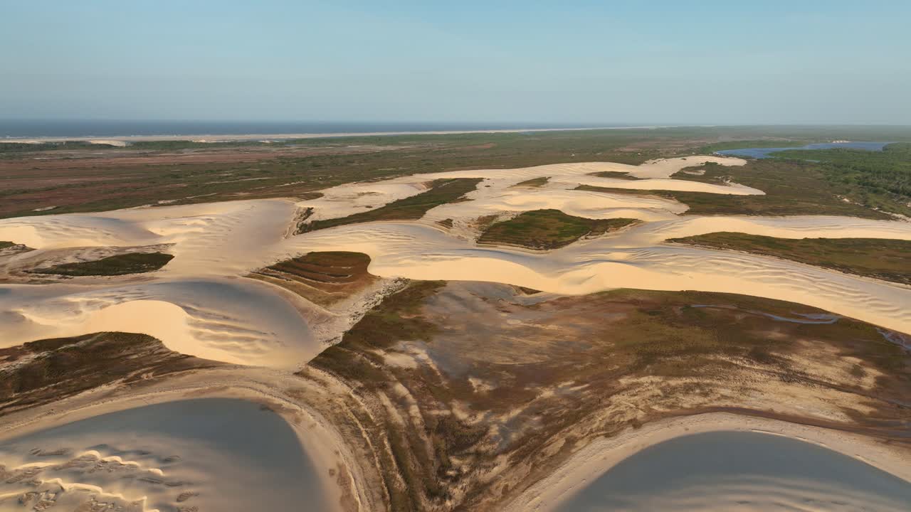 Breathtaking view of Parnaiba River with sand dunes in foreground in Araioses, Brazil. Aerial view.