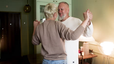 couple dancing at home