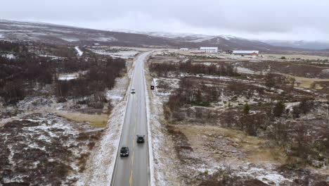 vehicles driving in the road during winter near dovre municipality in norway