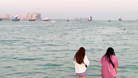 local-Qatari-boats-with-world-cup-countries'-flags-on-it-pass