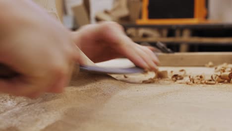 Woodworker-working-on-a-design-table