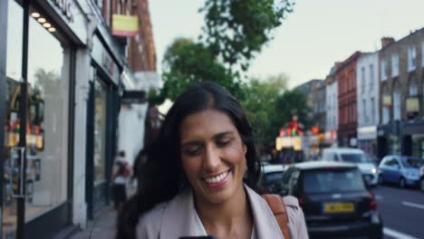 beautiful indian woman walking through city