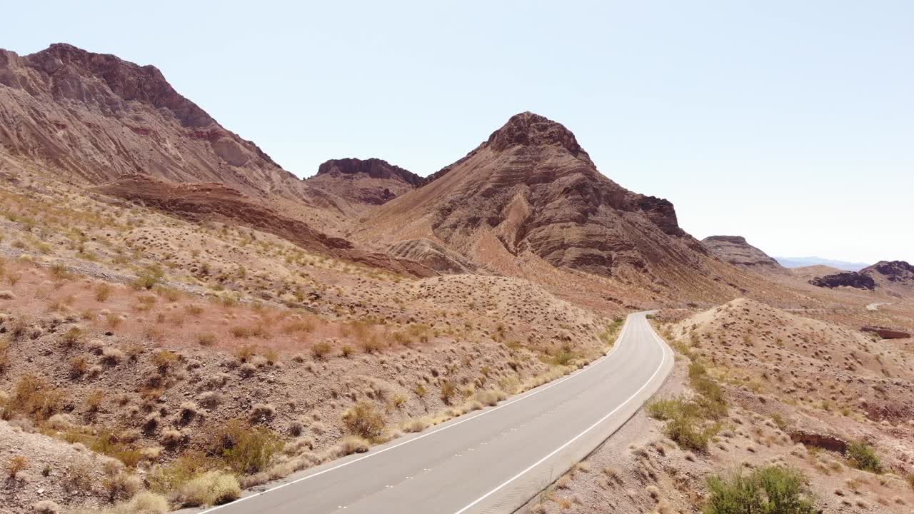 Desert Road Winding Through Arid Mountains