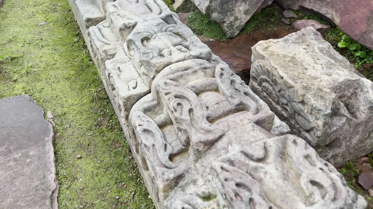 As the camera pushes in, the detailed stone carving at Sanchi reveals ornate motifs and symbolic designs, showcasing the artistry and craftsmanship of ancient Indian Buddhist architecture