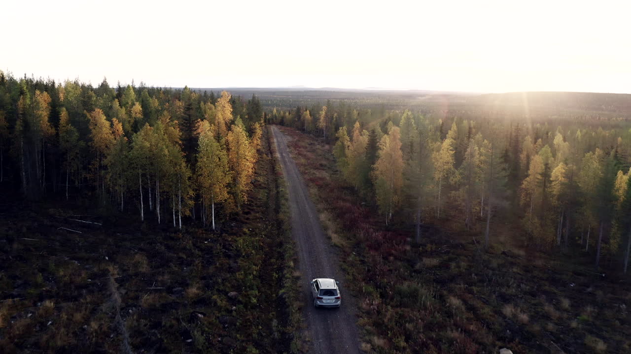 Car chase in Fall colors in beautiful Finnish Lapland