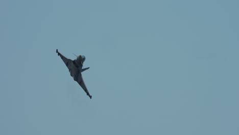 jet aircraft flying overhead with visible undercarriage and decorated tail wings during flight