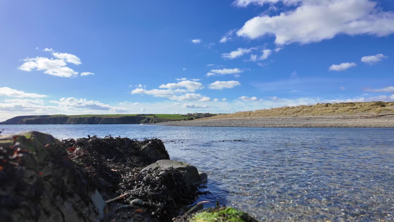 Ireland Gentle incoming waves crystal clear waters Copper Coast Waterford in spring