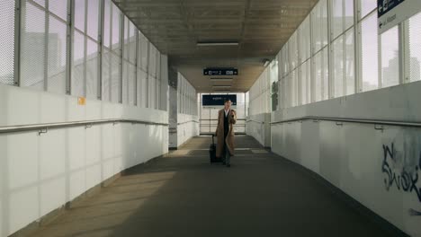 woman walking through modern train station