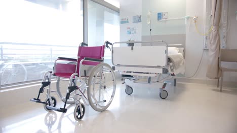 Close-up-of-wheelchair-in-sunny-hospital-room,-slow-motion